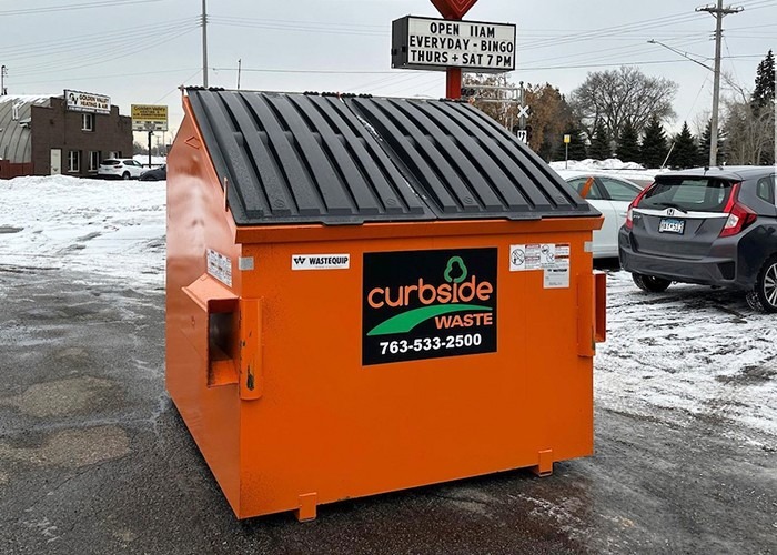 Curbside Waste dumpster rental in parking lot